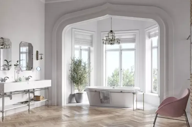 Elegancka łazienka vintage z wanną wolnostojącą, klasycznym oświetleniem i różowym fotelem